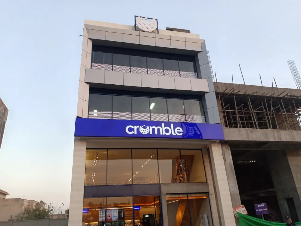 A bakery shopfront with a branded fascia board